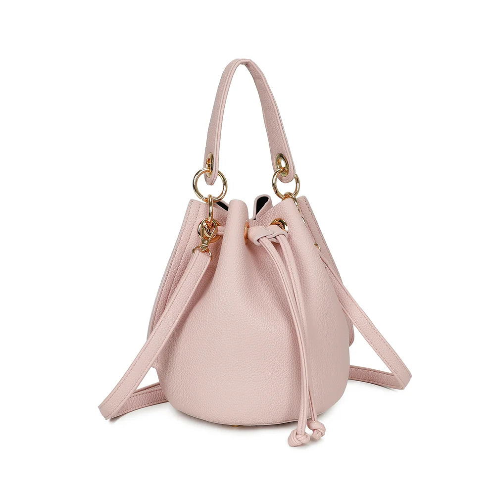 Éclat de Rêve rose vu de trois-quarts : silhouette arrondie et anneaux en métal doré – réf. KJ-62050