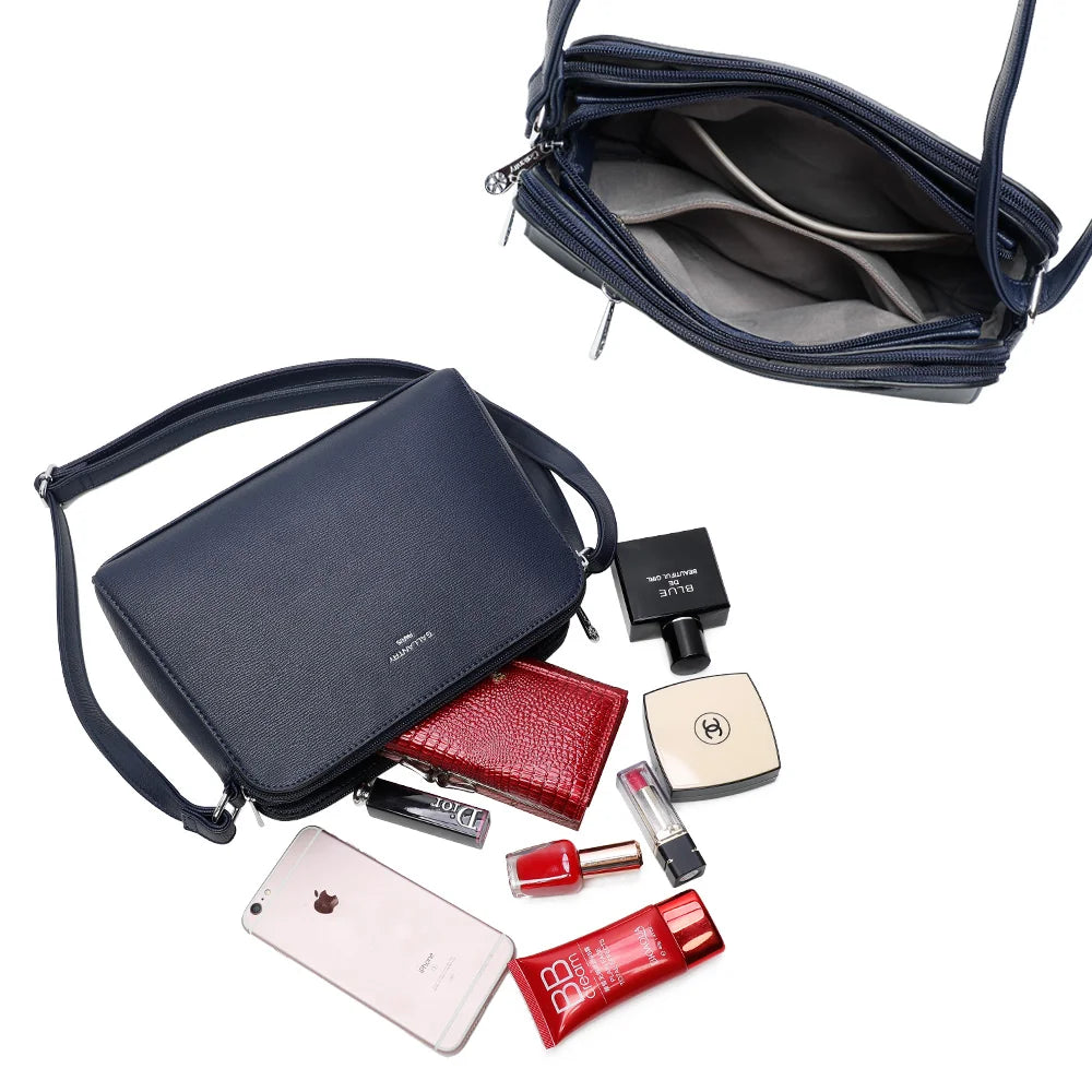 Intérieur du Gallante bleu foncé : plusieurs compartiments zippés pour ranger téléphone, carnet et maquillage – réf. G-7432-2