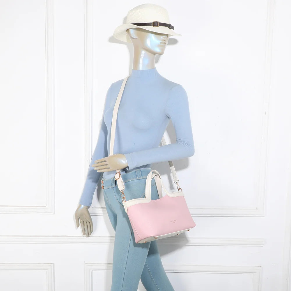 Sac à main Horizon Duo rose/beige porté par une femme, à la main ou avec sa bandoulière amovible – réf. R-2038