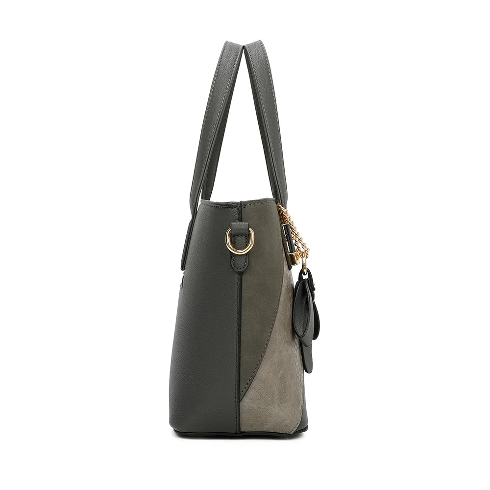 Profil de L’Ingénieuse Mini gris foncé, avec l’anneau doré qui retient la bandoulière amovible – réf. Z-9329-34