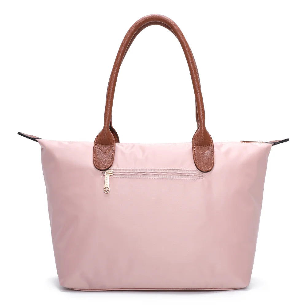 Dos de La Balade Medium rose claire : nylon uni et anses marron surpiquées cousues sur le haut du sac – réf. Z-03