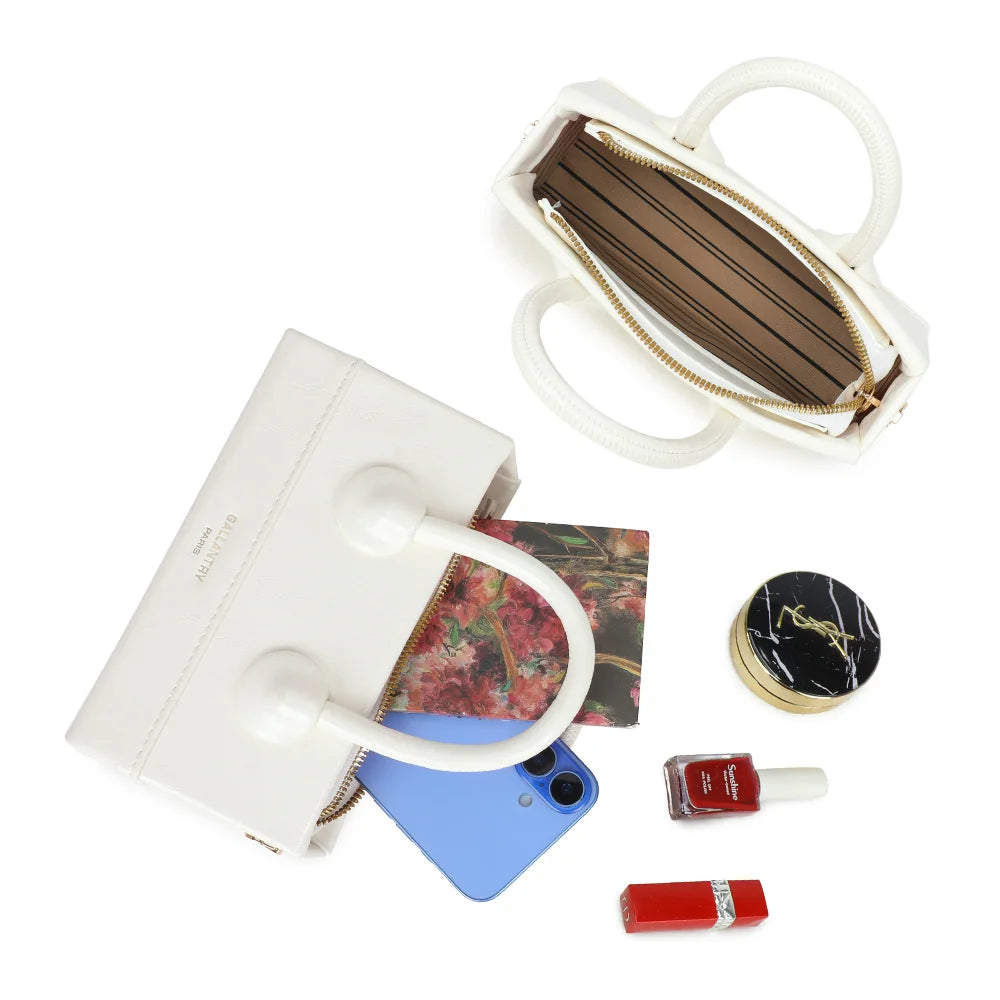 Intérieur zippé du La Mona blanc : doublure rayée pour le téléphone, les clés et un rouge à lèvres – réf. YL-26025