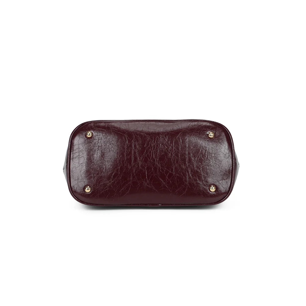 Dessous de La Parure bordeaux : base plate protégée par de petits pieds métalliques dorés – réf. R-2065