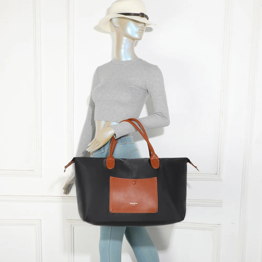 Sac cabas femme La Vadrouille Chic noir porté à l’épaule grâce à ses longues anses cognac – réf. Z-04-1