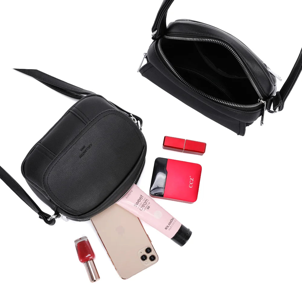 Intérieur du Le Mélina noir : compartiment zippé pour téléphone, rouge à lèvres et poudrier – réf. KJ-62004