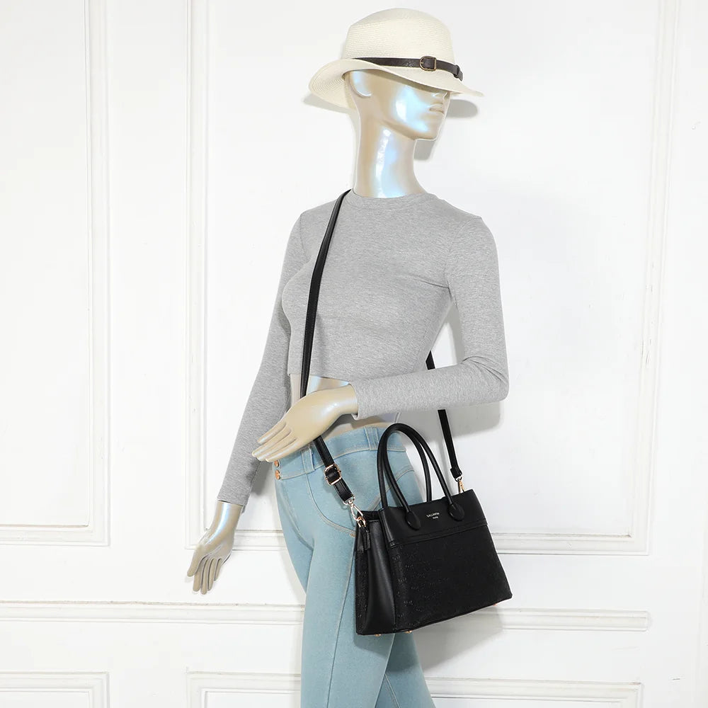 Sac à main femme Le Mélys noir porté, à la main ou en bandoulière grâce à sa sangle amovible – réf. R-2072