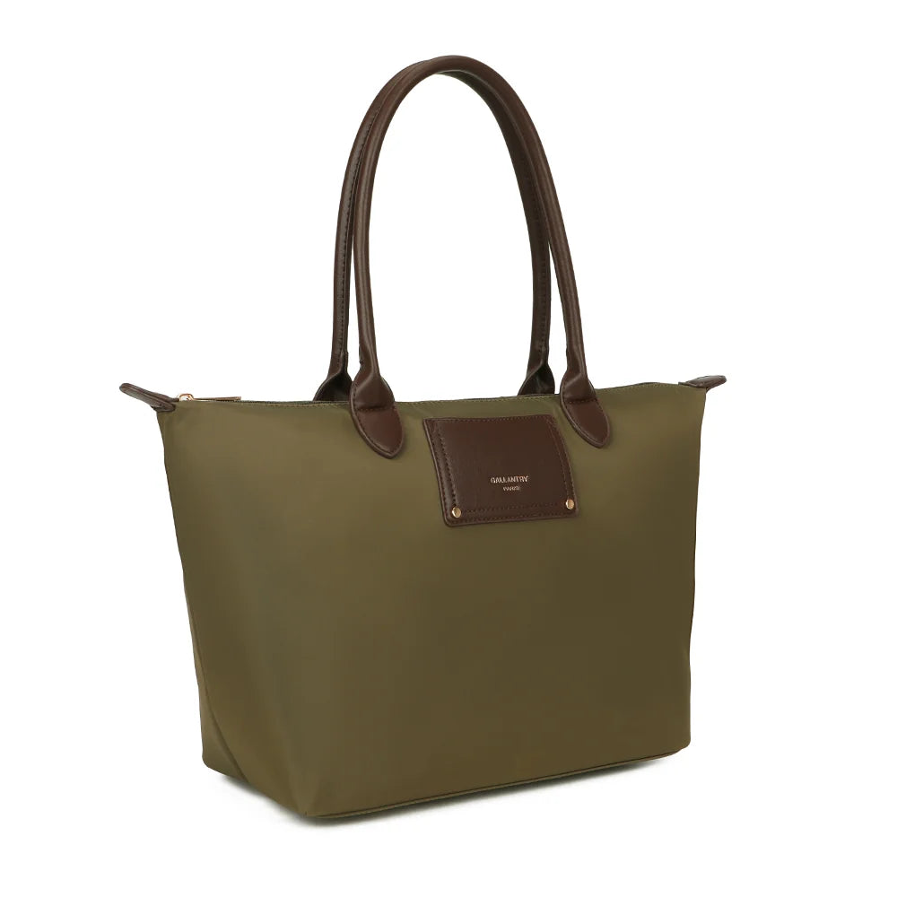 Le Meralis vert foncé de trois quarts : silhouette évasée, longues anses marron et fermeture zippée – réf. Z-06-1