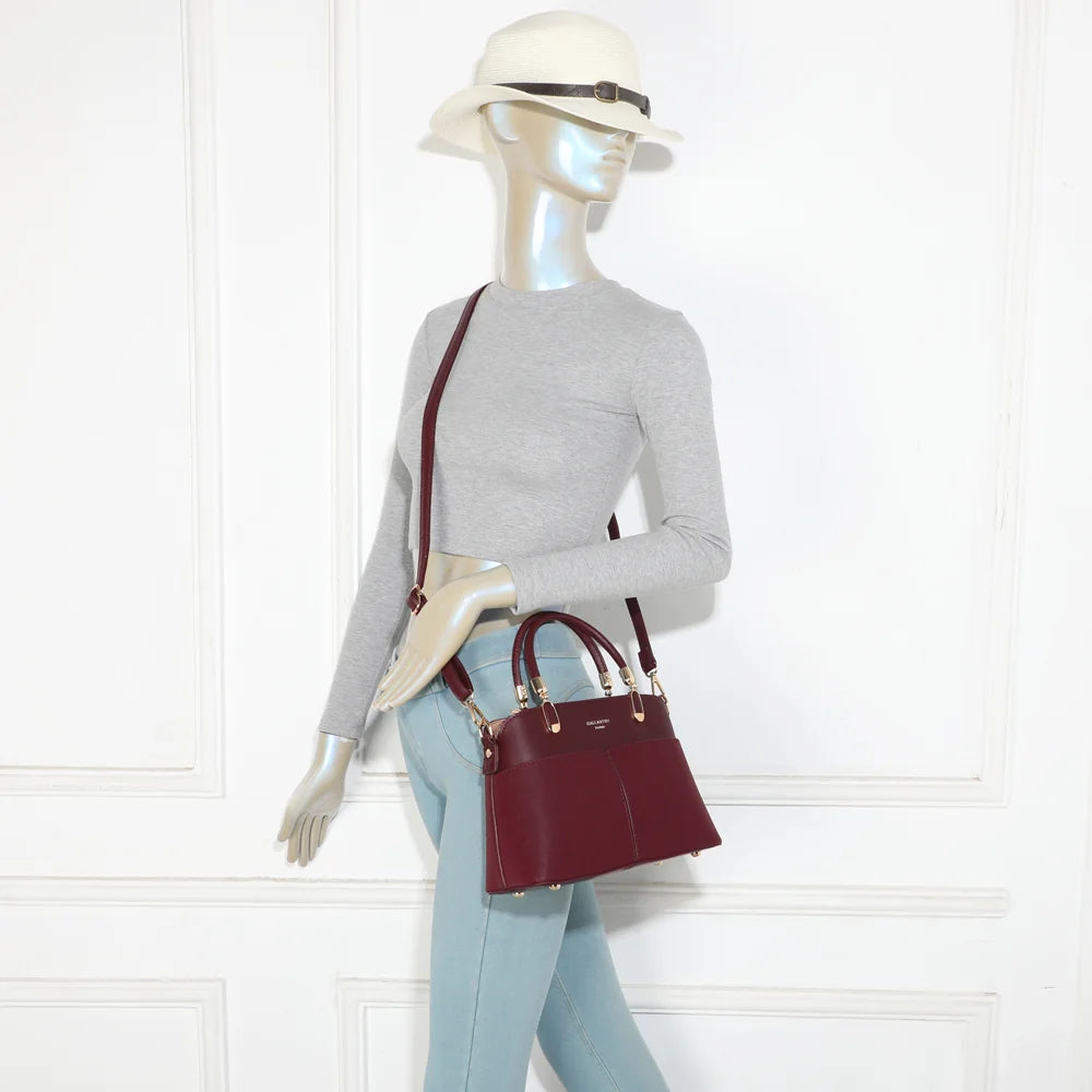 Sac à main femme Le Valmont bordeaux porté à la main, format équilibré et élégant – réf. A-9177