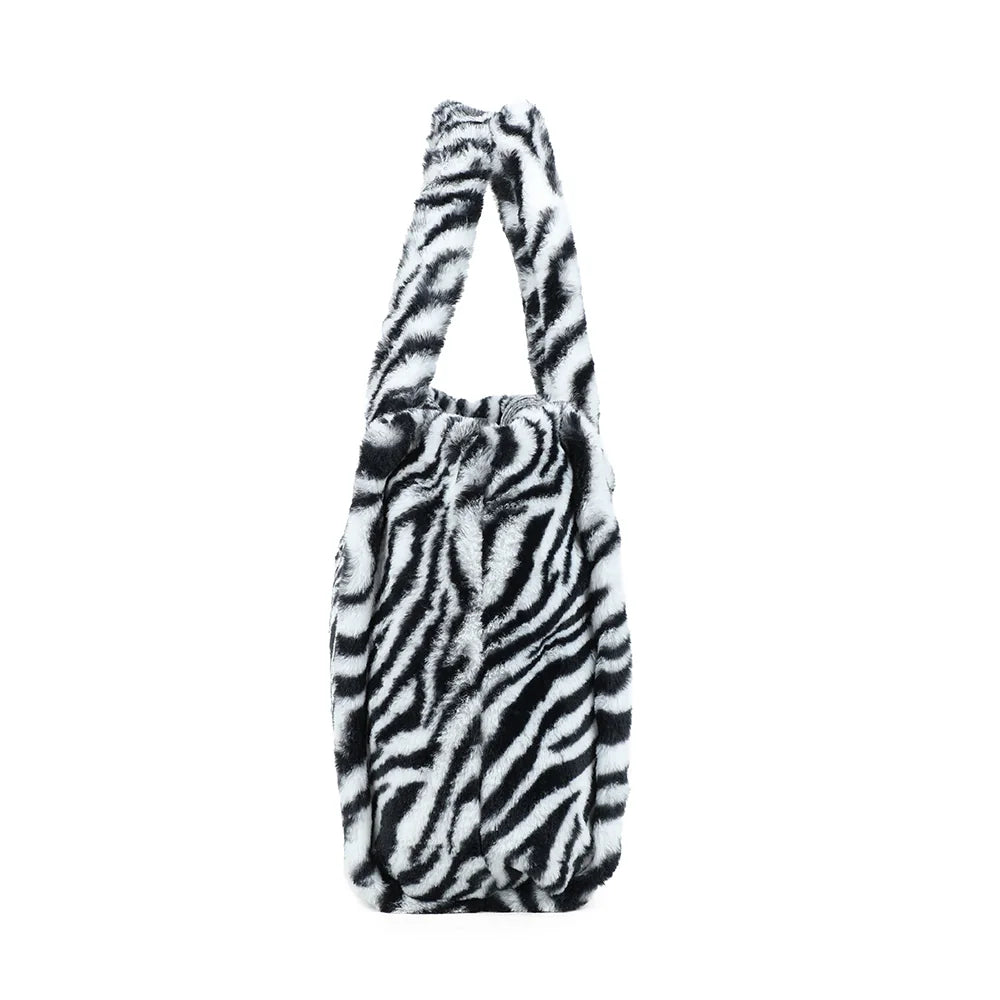 Profil du Mélya zebre : soufflet latéral et profondeur de 18 cm pour tout emporter – réf. DG-5802