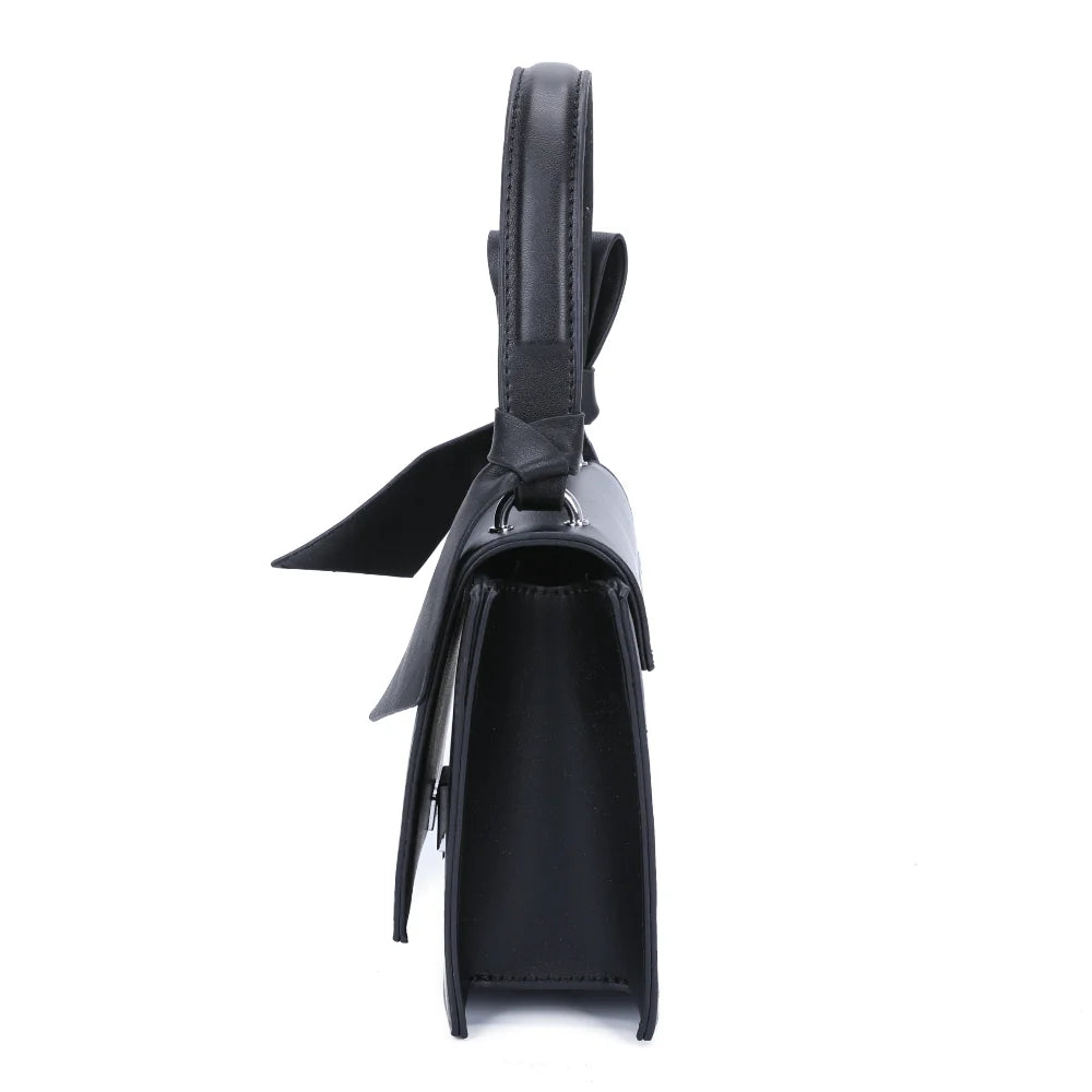 Profil du Mignonne noir : format compact de 7 cm de profondeur et nœud noir tombant sur le côté – réf. R-1551
