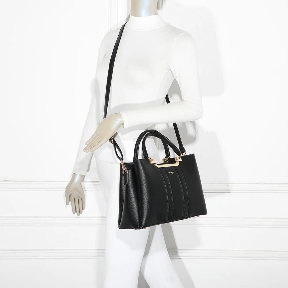 Sac à main femme Symphonie Graphique noir porté, bandes contrastées et armature en métal doré – réf. DQ-8605-4