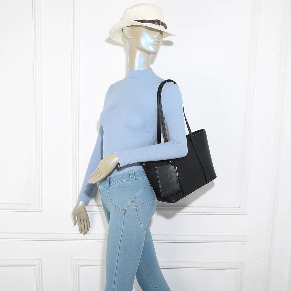Sac cabas femme Alméa noir porté à l’épaule grâce à ses longues anses de 28 cm