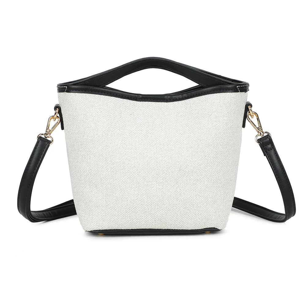 Ava Épure beige/noir de trois quarts : silhouette structurée et anse rigide contrastée – réf. R-2026-1