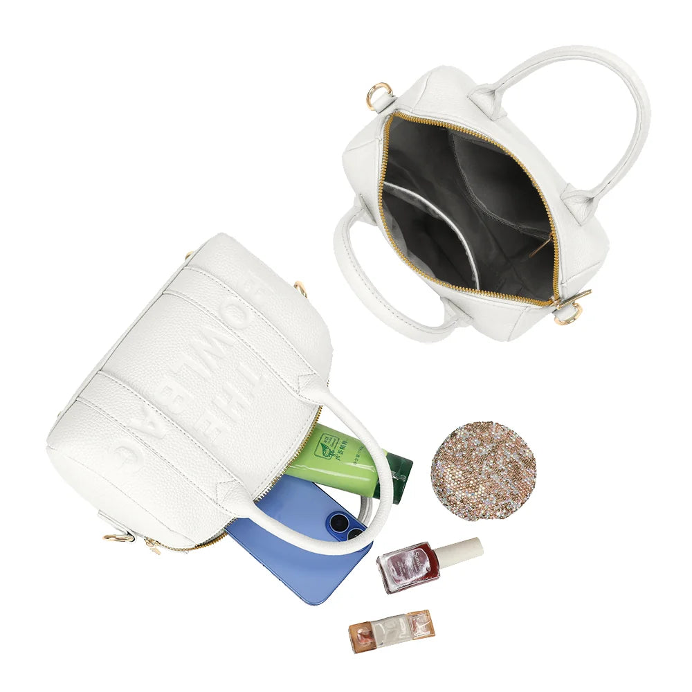 Intérieur du Bowlbag mini blanc : doublure synthétique, poche plaquée et essentiels du quotidien – réf. R-1995