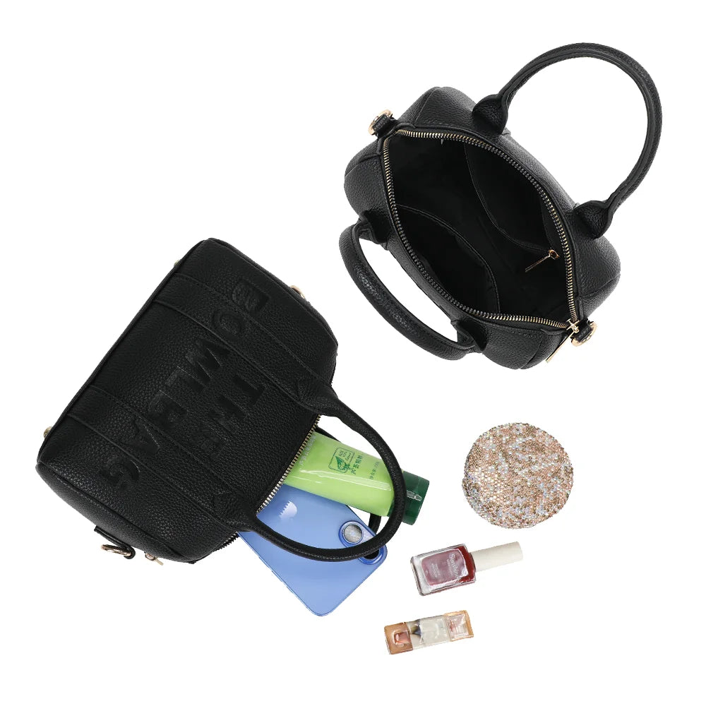 Intérieur du Bowlbag mini noir : doublure synthétique, poche plaquée et essentiels du quotidien – réf. R-1995