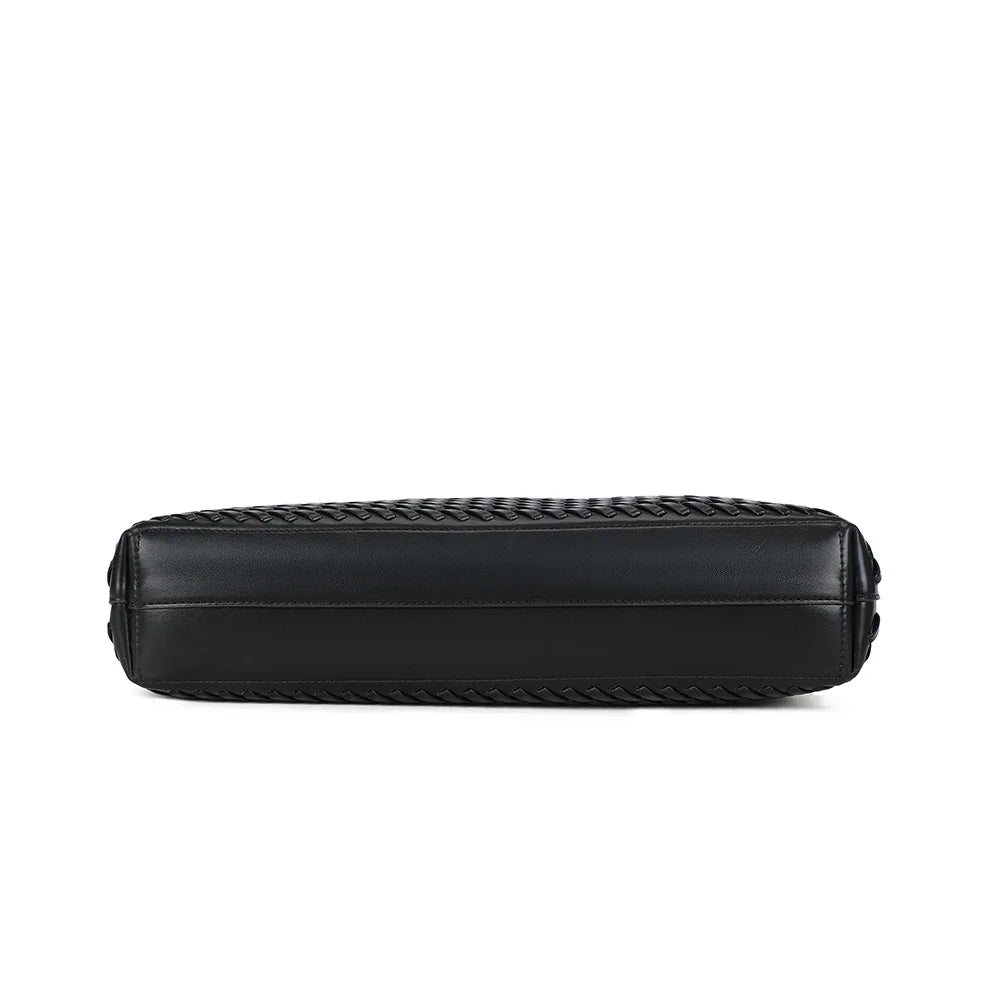 Dessous du Bréva noir : un fond rectangulaire de 38 × 8 cm qui donne au cabas sa ligne allongée et structurée – réf. DG-5822