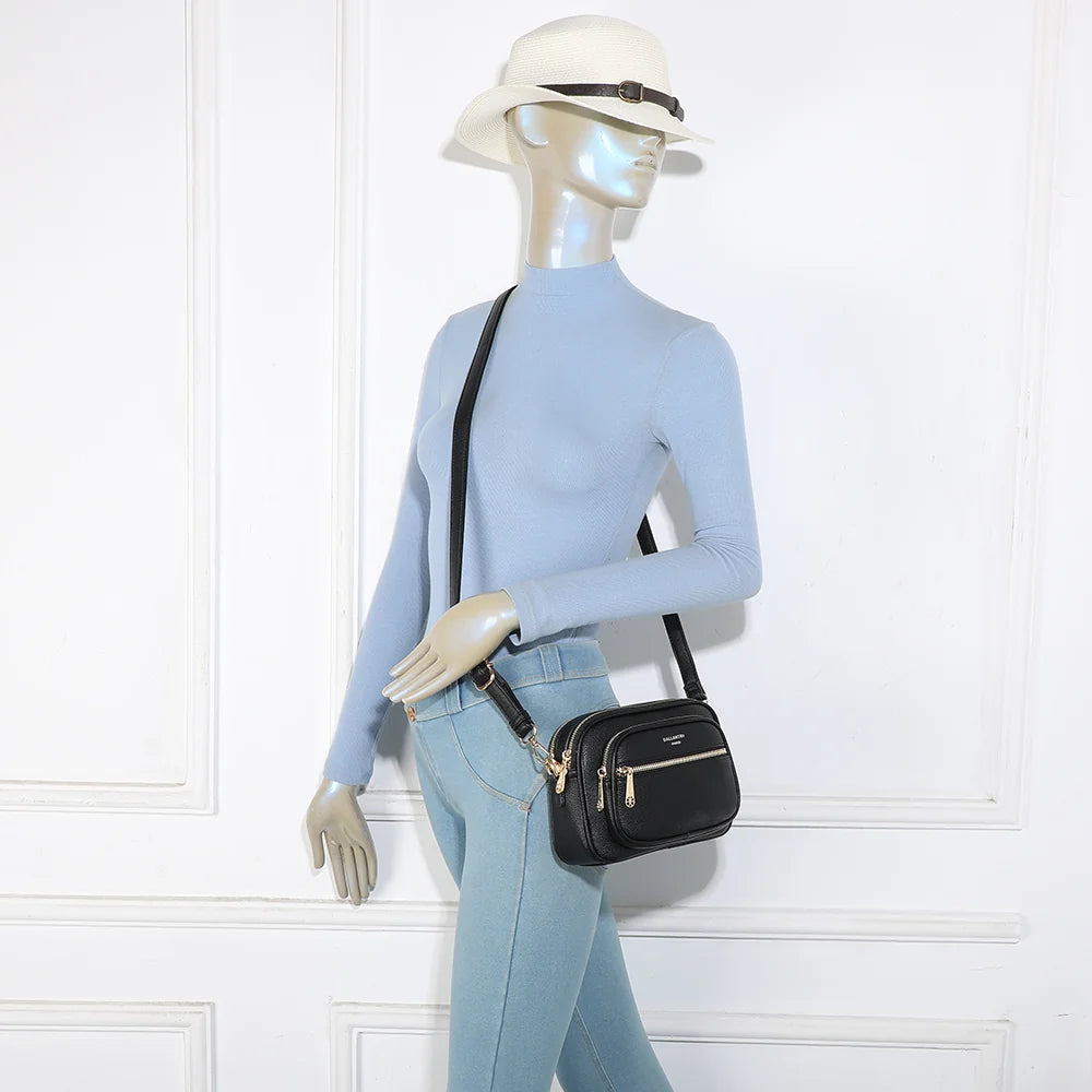 Sac bandoulière femme City Move noir porté en travers du corps, bandoulière réglable – réf. A-9163