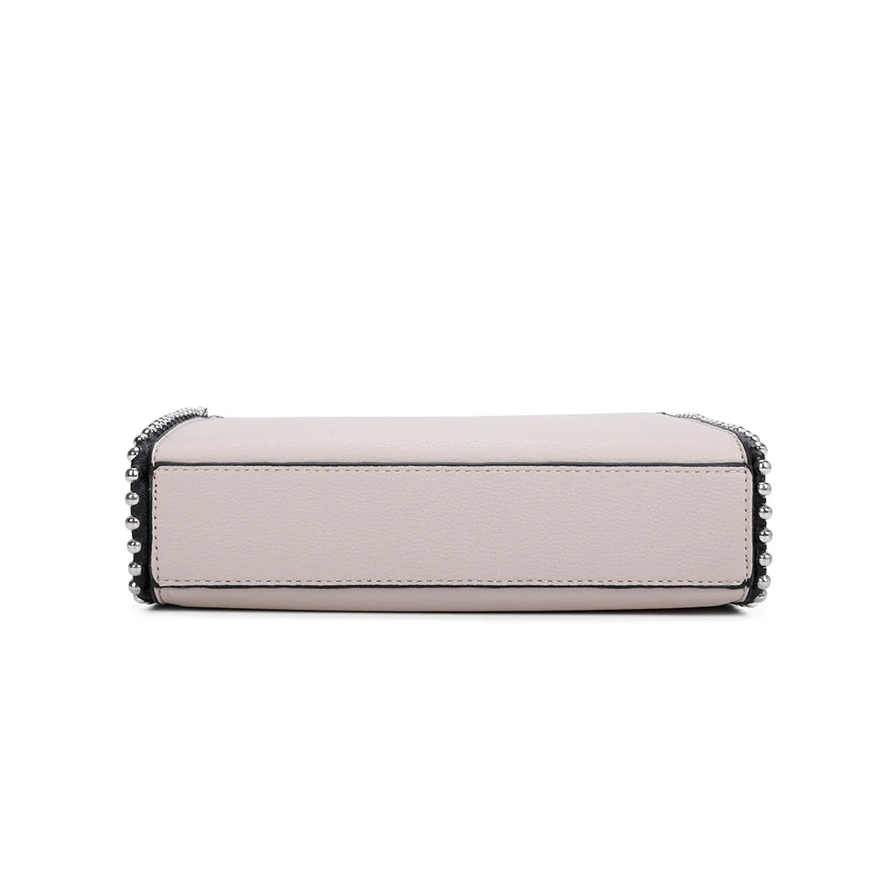 Élégance Perlée beige vue de dessous : base plate et nette, bordée d’un fin liseré noir – réf. R-1559