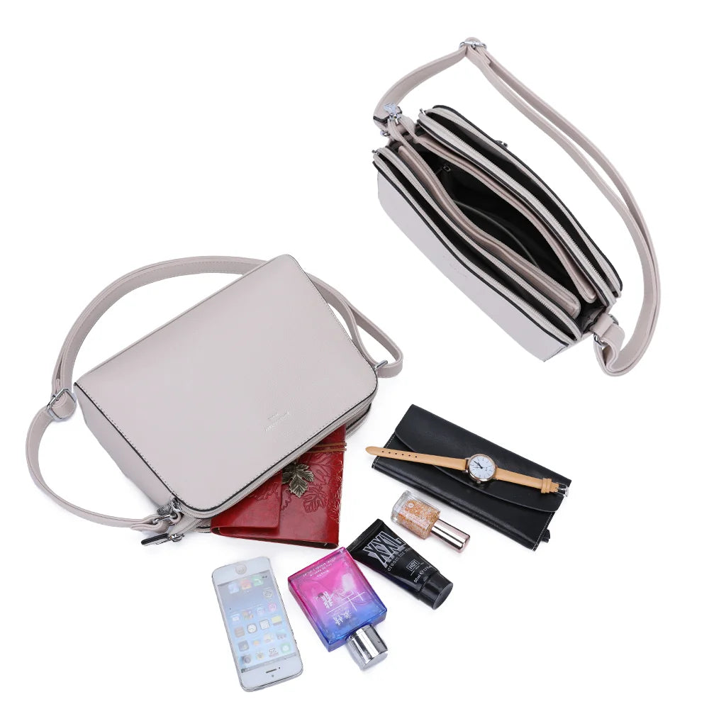 Intérieur du Gallante beige : plusieurs compartiments zippés pour ranger téléphone, carnet et maquillage – réf. G-7432-2