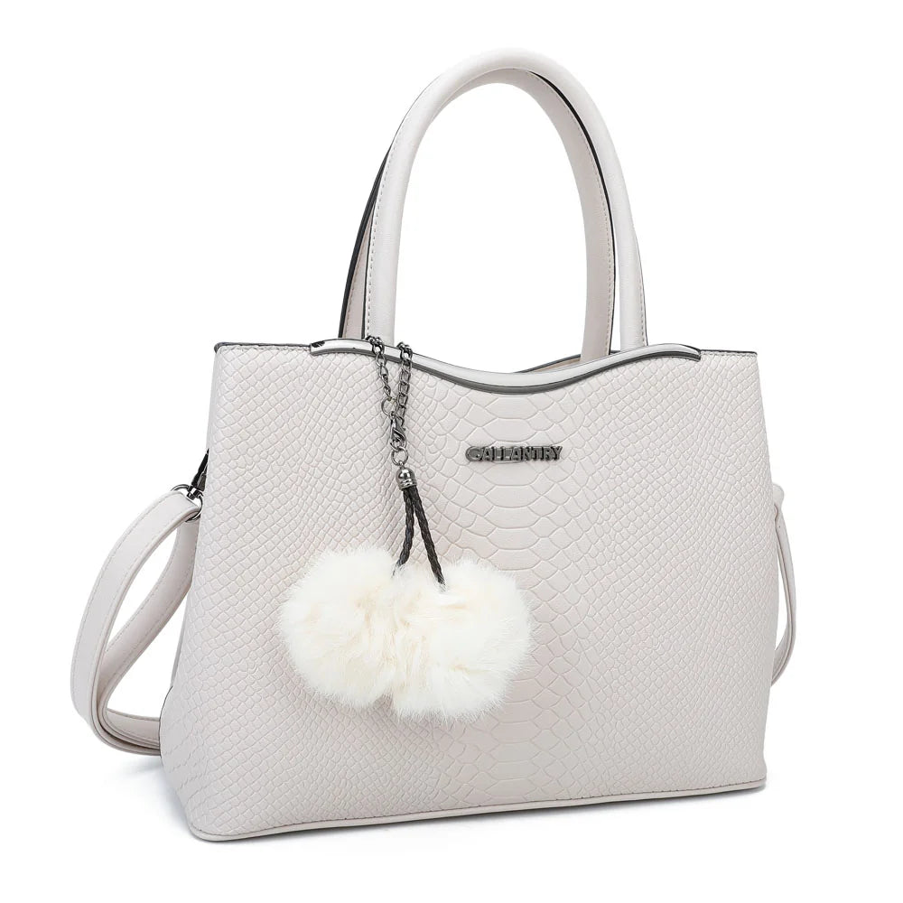 Hailey beige vu de trois quarts : silhouette structurée, barre métallique argentée et bandoulière amovible – réf. G-7329-1