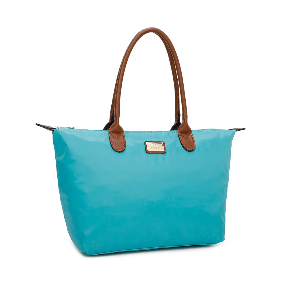 La Balade (Large) turquoise claire vu de trois quarts : forme cabas évasée et pattes de zip marron surpiquées – réf. Z-02