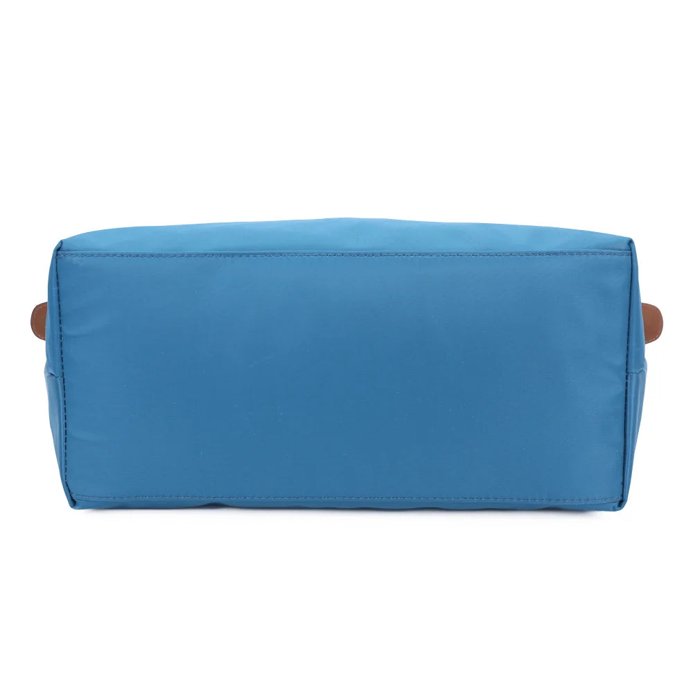 Dessous de La Balade (Large) turquoise, une base large en nylon pour un cabas qui tient bien – réf. Z-02