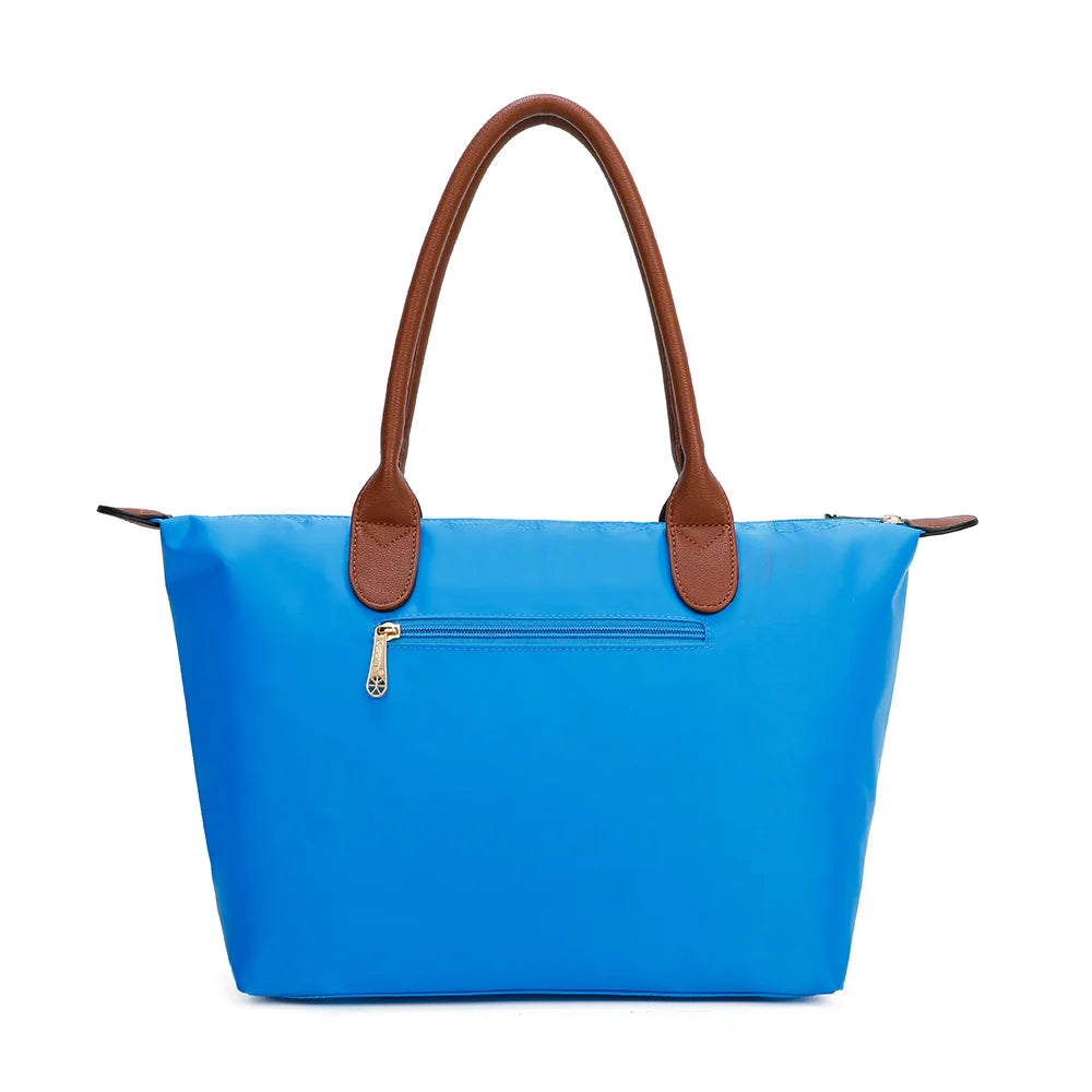 Dos de La Balade Medium bleu electrique : nylon uni et anses marron surpiquées cousues sur le haut du sac – réf. Z-03
