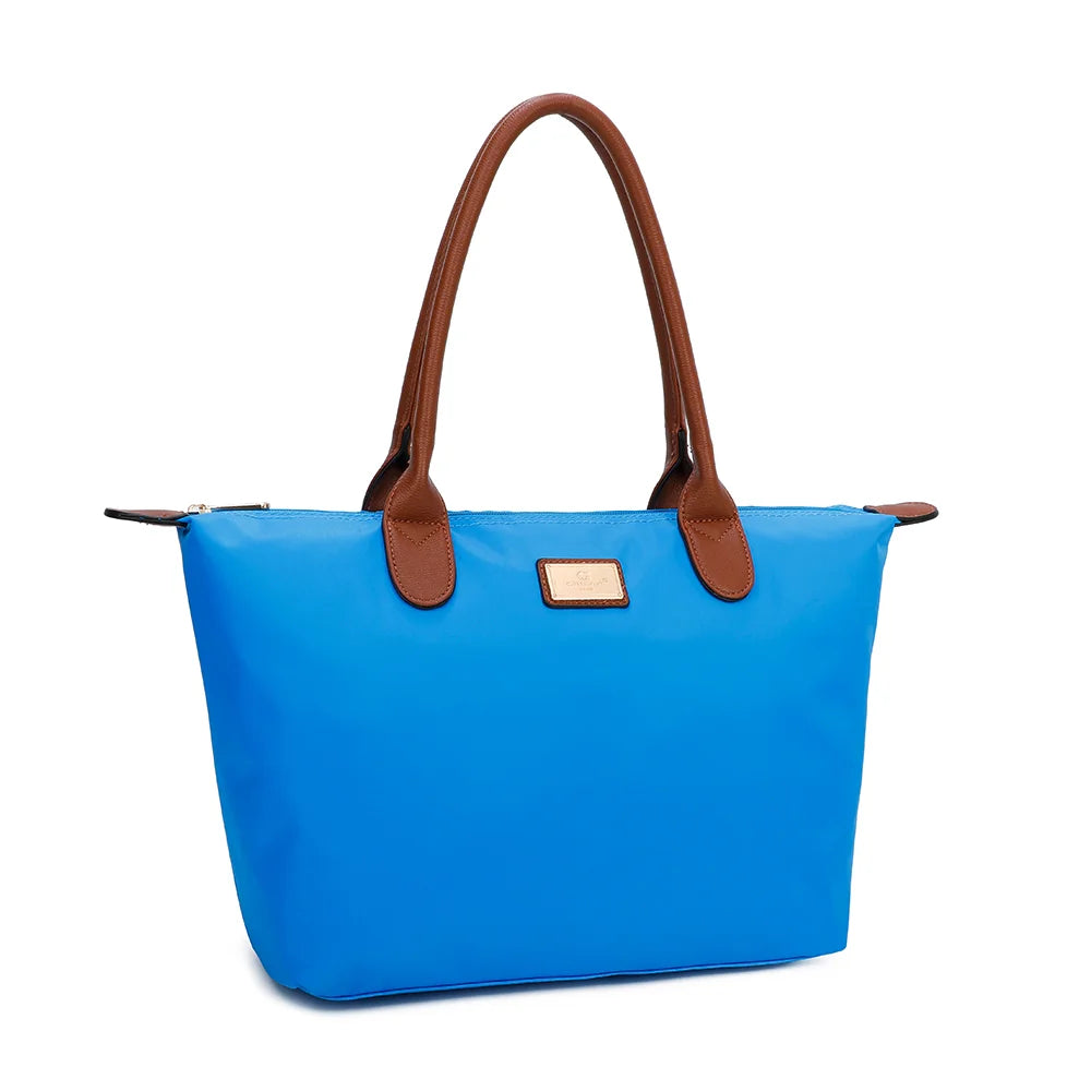 La Balade Medium bleu electrique vue de trois quarts : silhouette évasée et pattes marron aux extrémités du zip – réf. Z-03