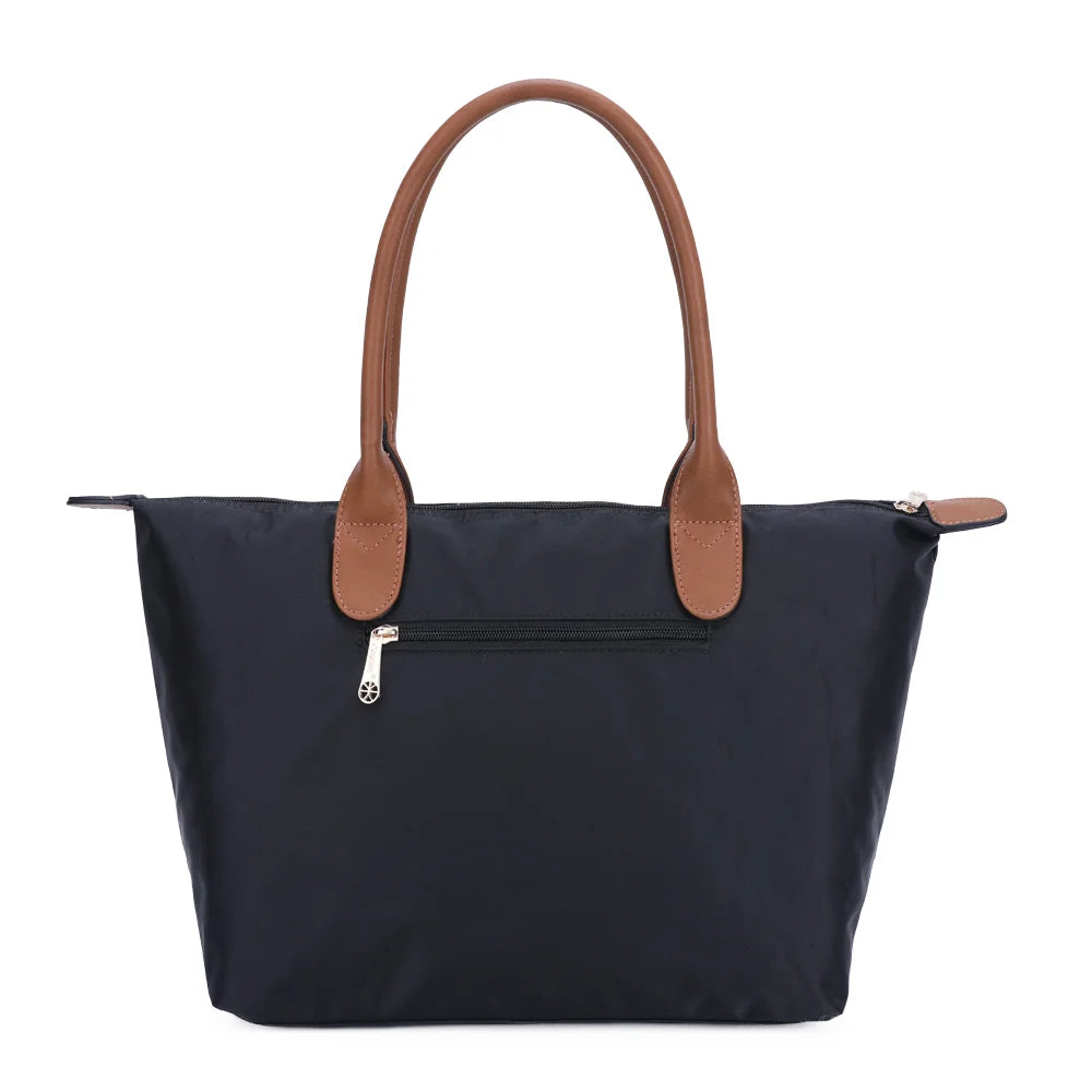 Dos de La Balade Medium noir : nylon uni et anses marron surpiquées cousues sur le haut du sac – réf. Z-03
