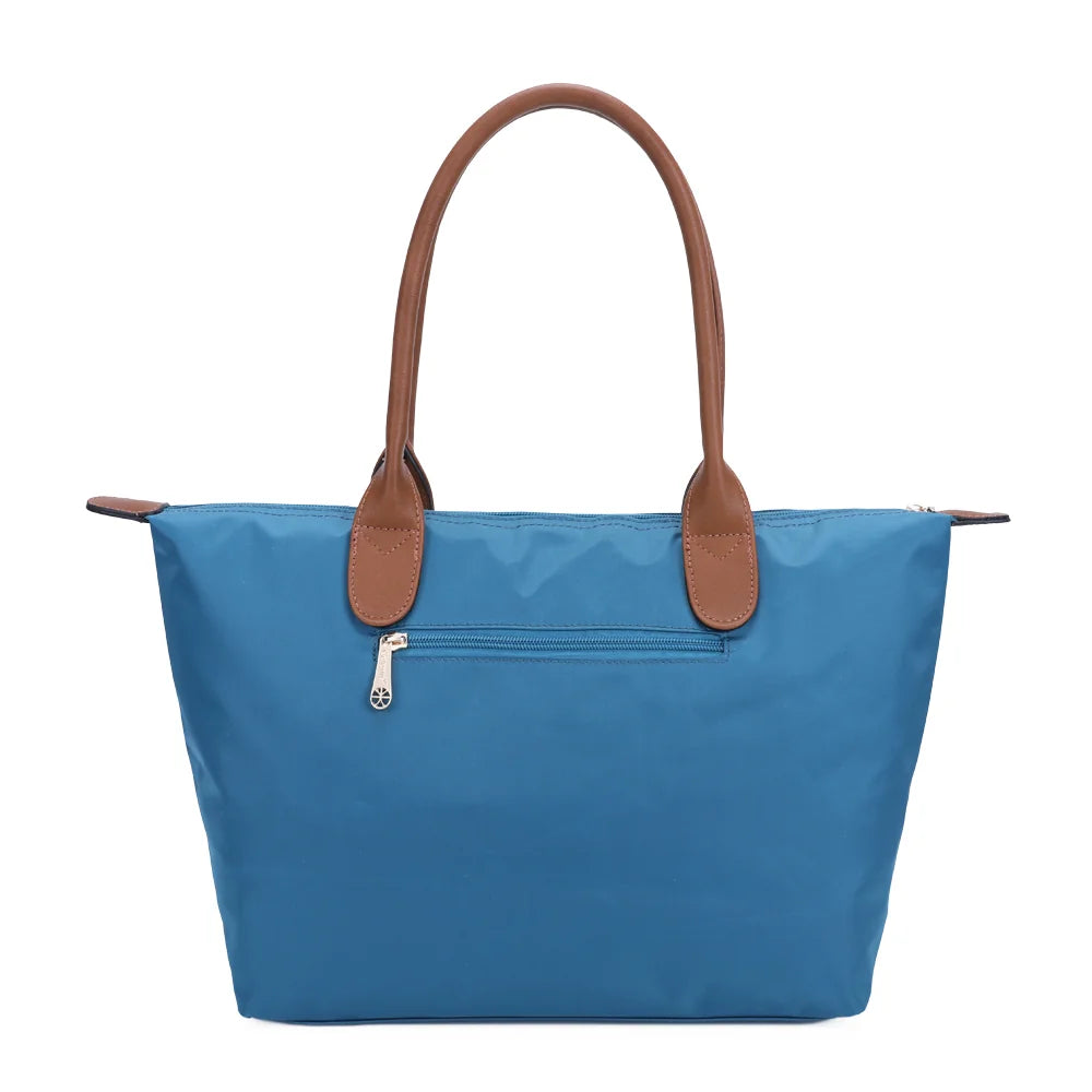Dos de La Balade Medium turquoise foncé : nylon uni et anses marron surpiquées cousues sur le haut du sac – réf. Z-03
