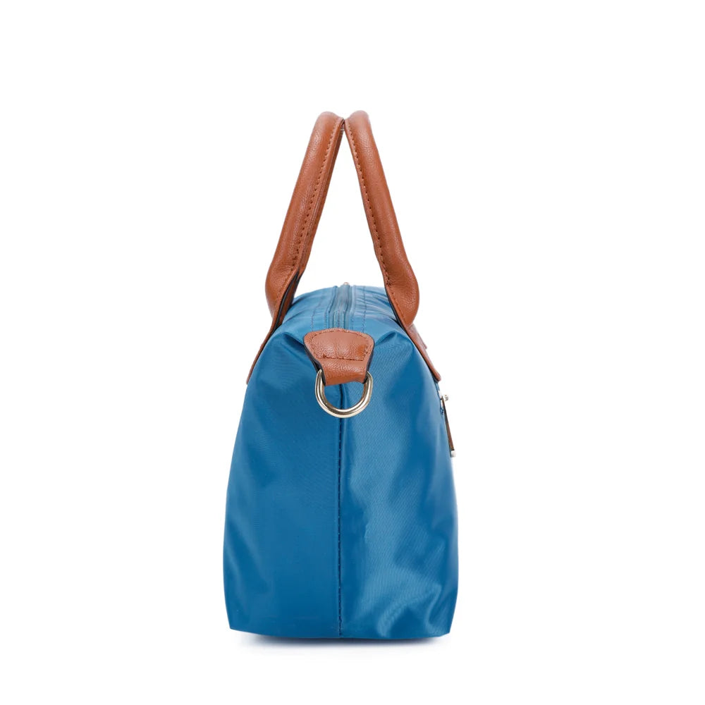 Profil de La Balade bleu canard : patte latérale en simili cuir et anneau doré pour la bandoulière – réf. Z-01
