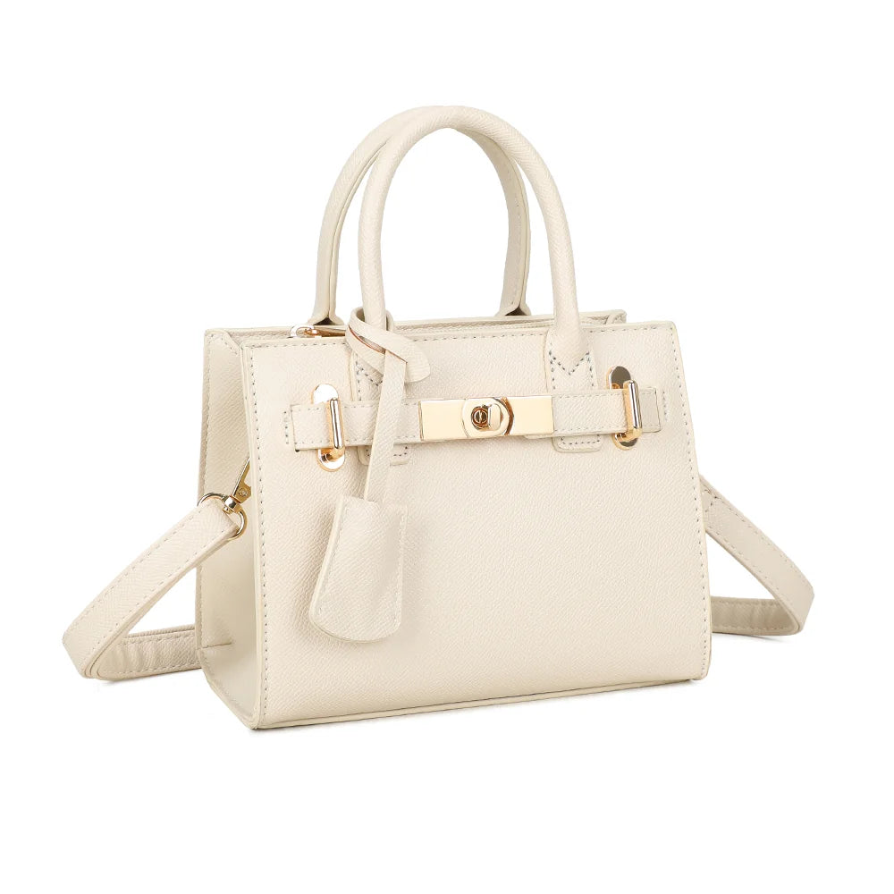 La Colette beige vue de trois quarts : silhouette structurée, sangle frontale et clochette décorative – réf. R-2059