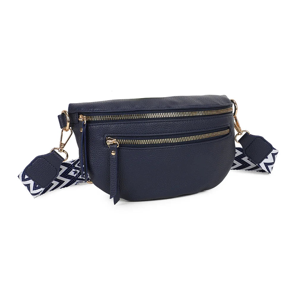 La Élégia bleu foncé de trois quarts : silhouette arrondie et poche zippée frontale – réf. R-1926-1