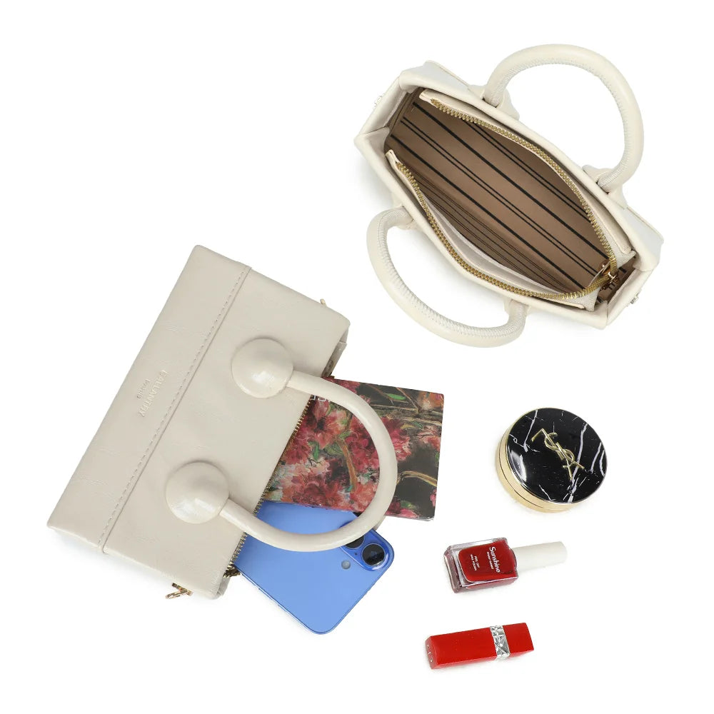Intérieur zippé du La Mona beige : doublure rayée pour le téléphone, les clés et un rouge à lèvres – réf. YL-26025