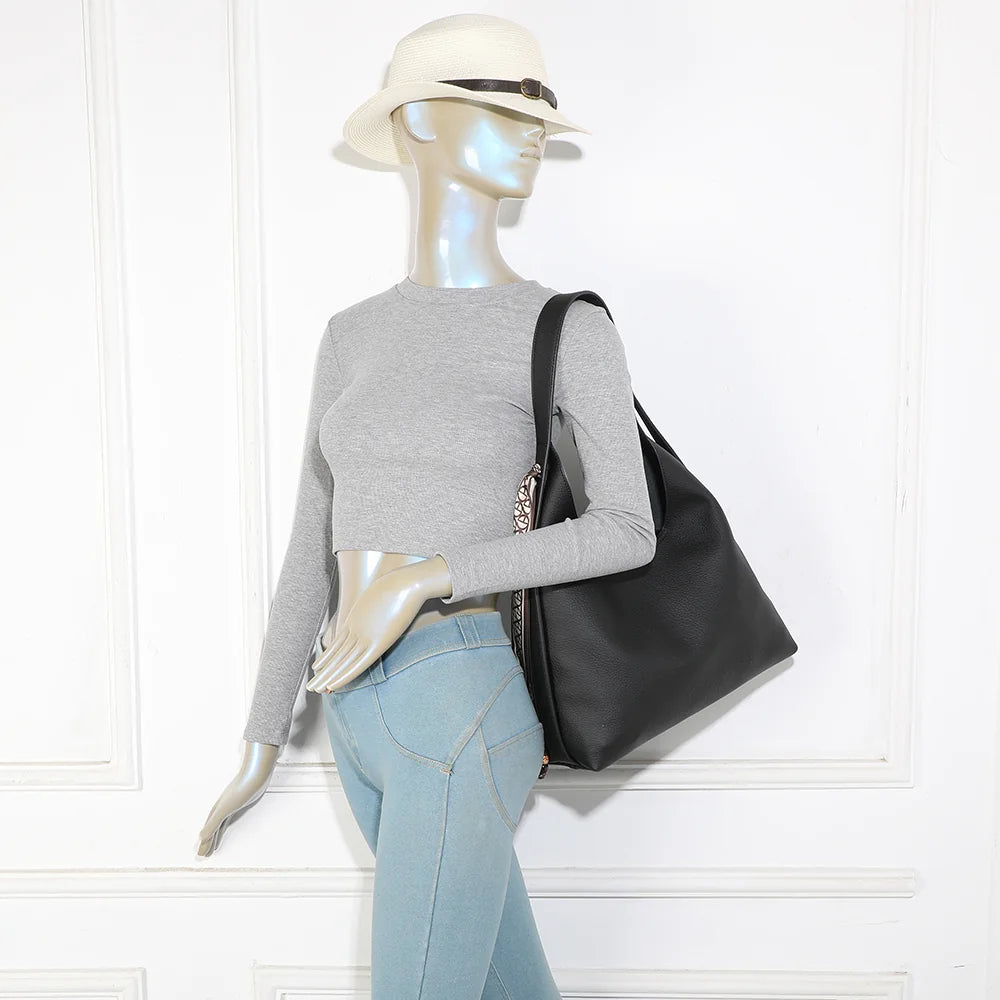 Sac femme La Nérélie noir porté à l’épaule : un grand format souple et élégant au quotidien – réf. R-2053