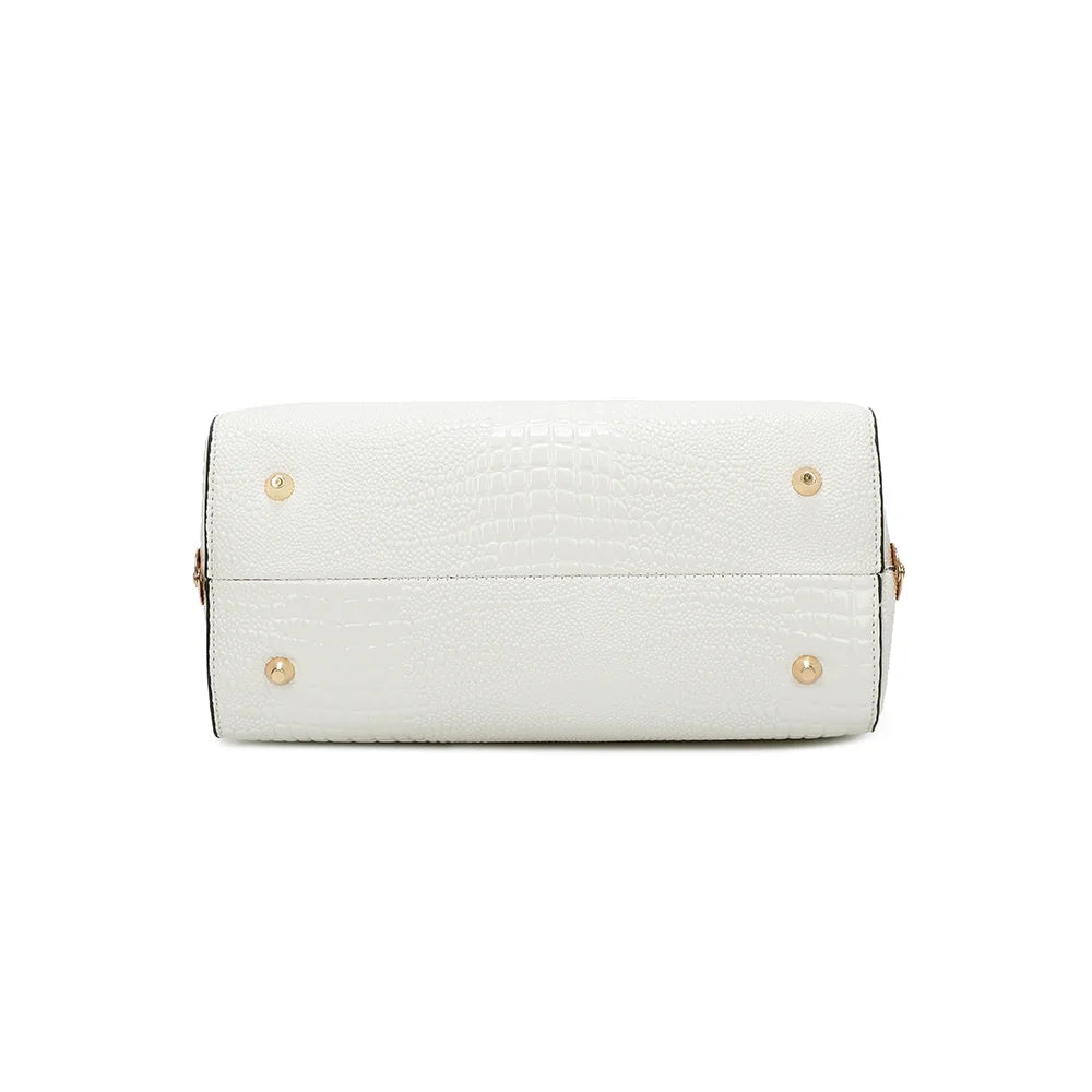 Dessous du sac La Rosalia blanc, posé sur des pieds de protection dorés – réf. R-1714