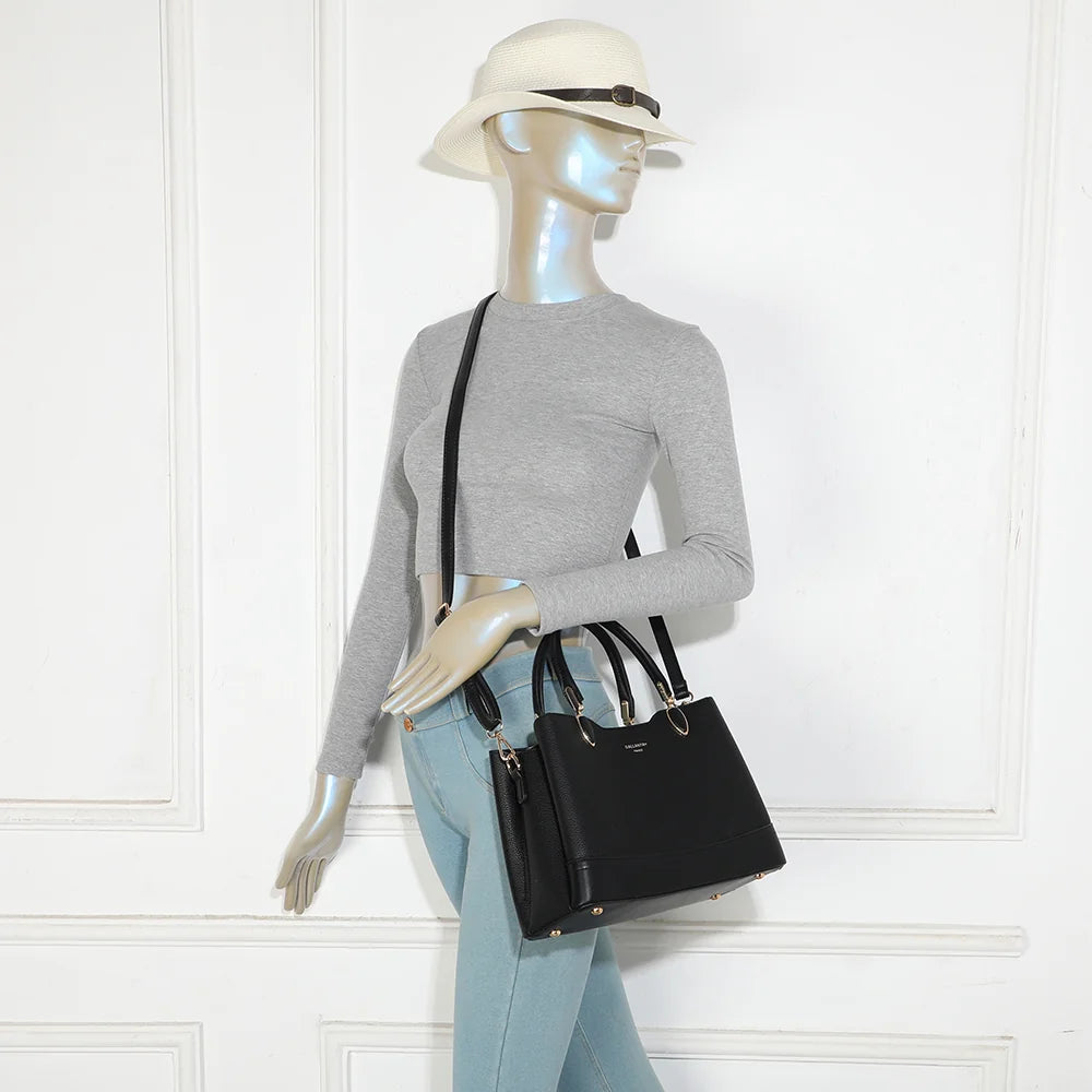 Sac à main femme Le Belvane noir porté, à la main ou en bandoulière grâce à sa sangle amovible – réf. DQ-8740