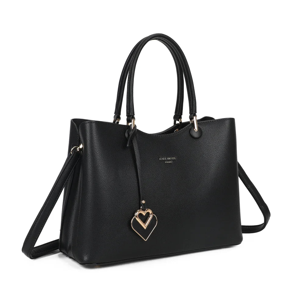 Le Lazare noir de trois quarts : silhouette structurée, deux anses et bijou de sac double cœur – réf. G-7510