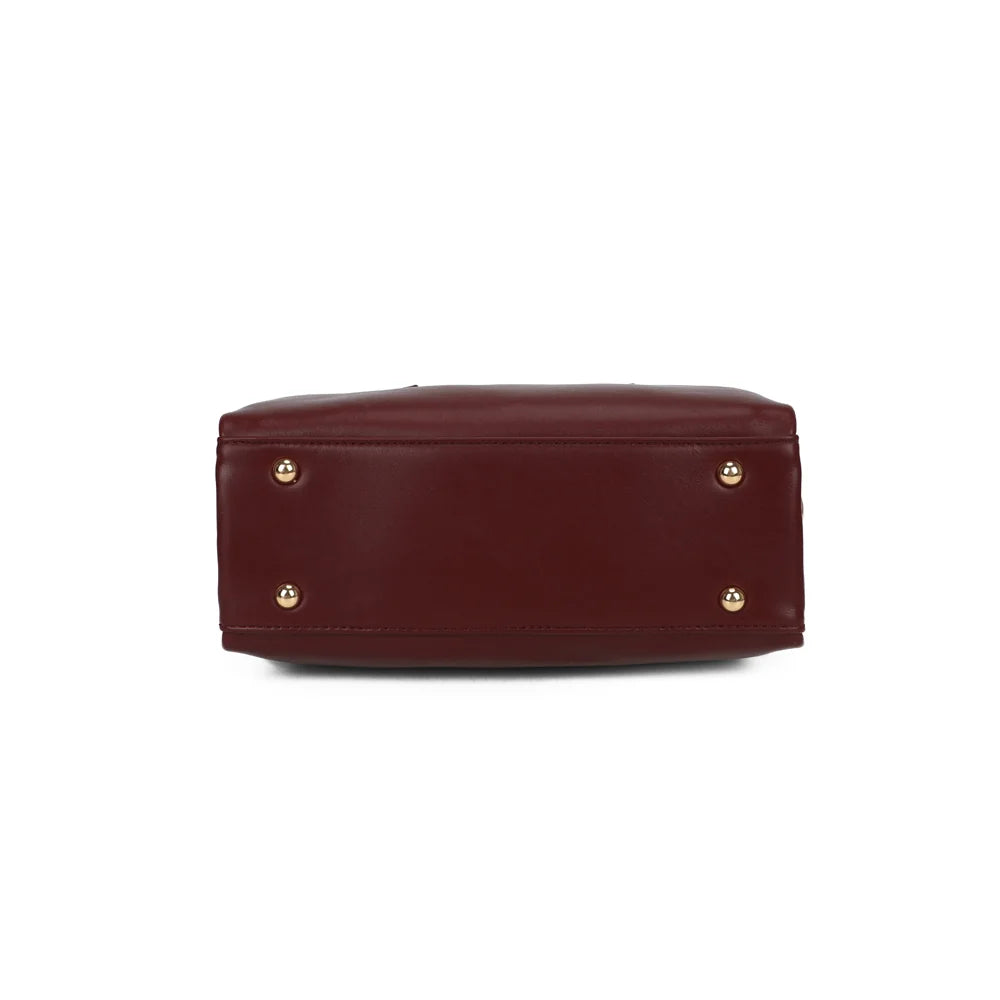 Dessous du sac Le Lorian bordeaux, vu à plat pour apprécier sa forme bowling de 11 cm de profondeur – réf. R-2069