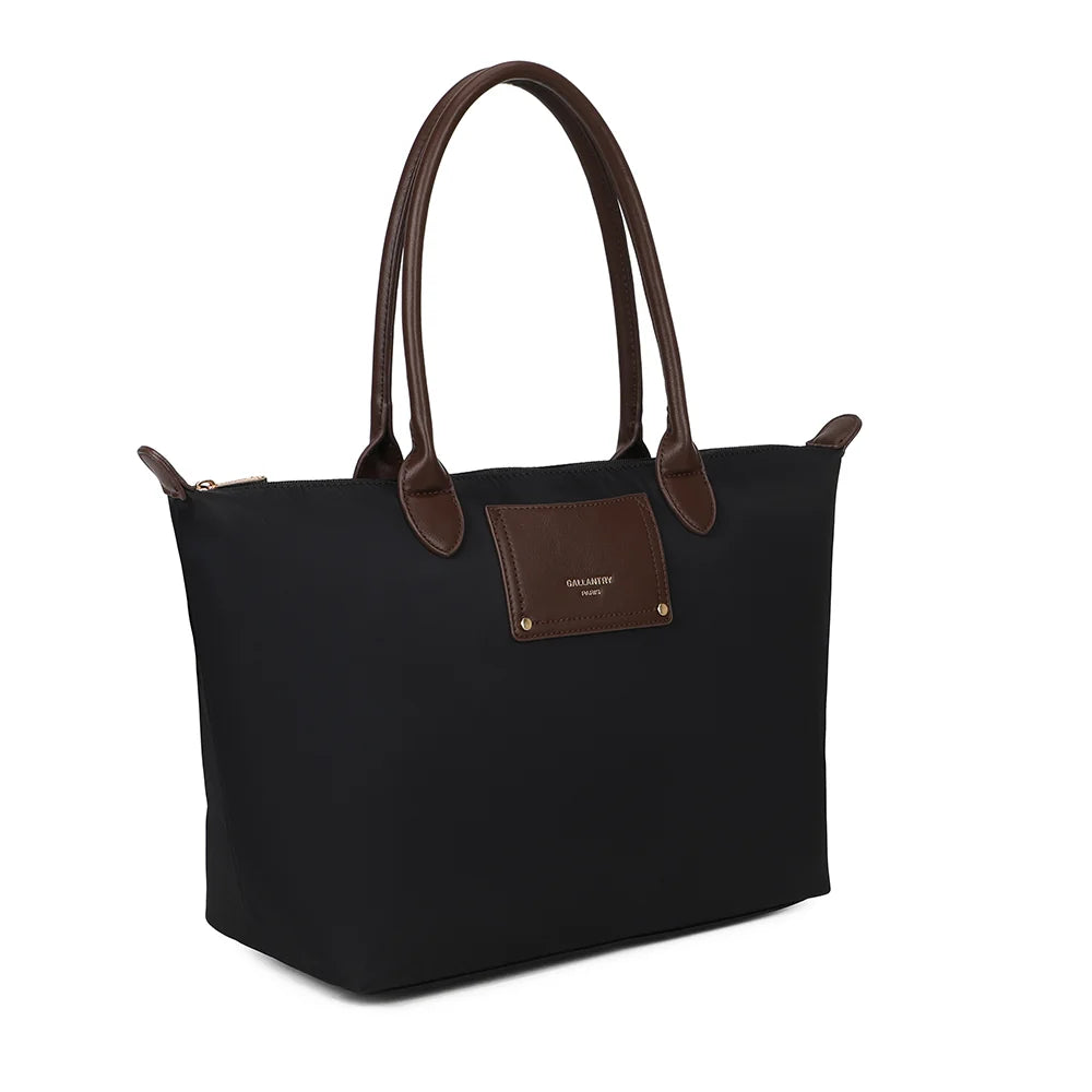 Le Meralis noir de trois quarts : silhouette évasée, longues anses marron et fermeture zippée – réf. Z-06-1