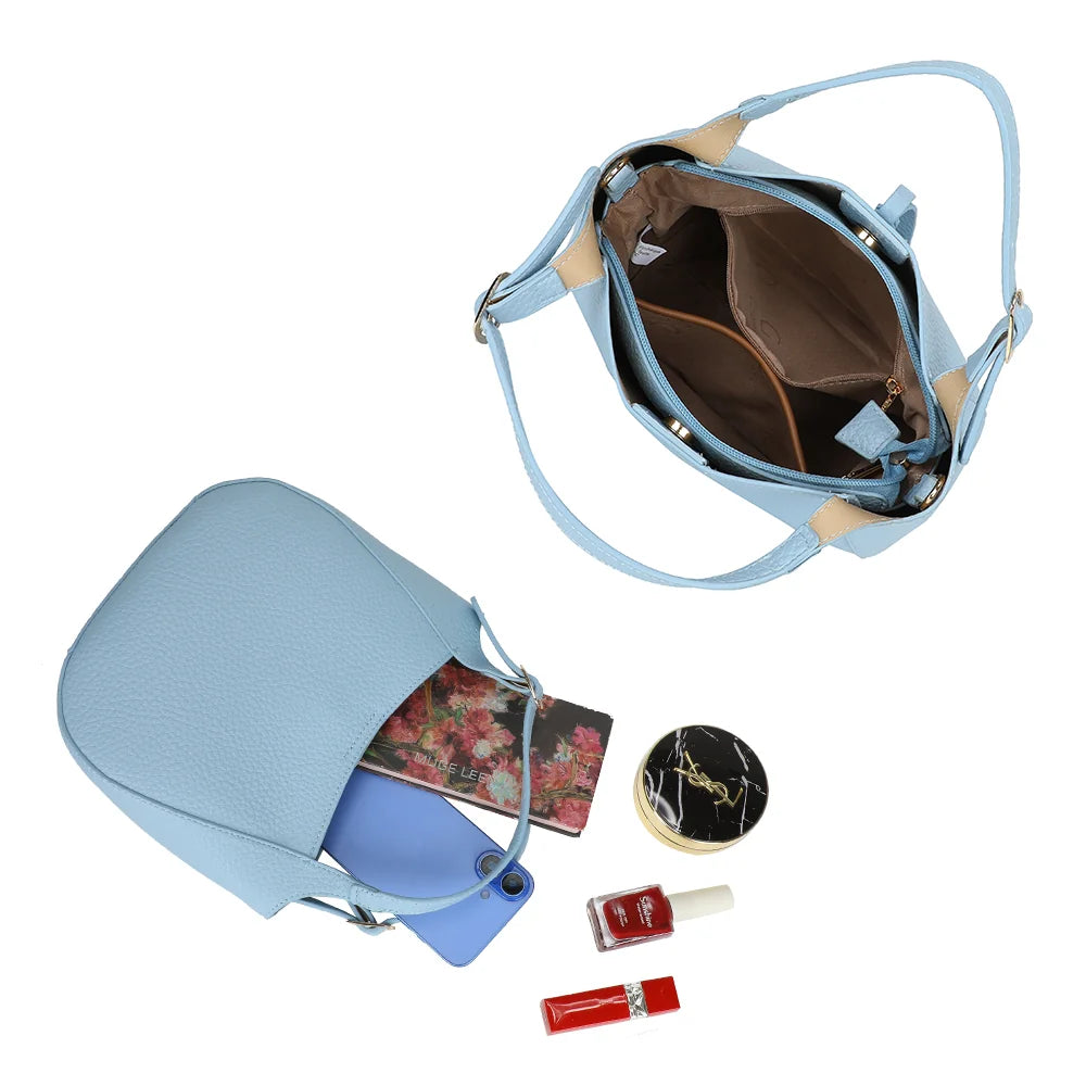 Intérieur du Le Nolan bleu clair : compartiment principal zippé pour téléphone et petits essentiels – réf. KJ-62098