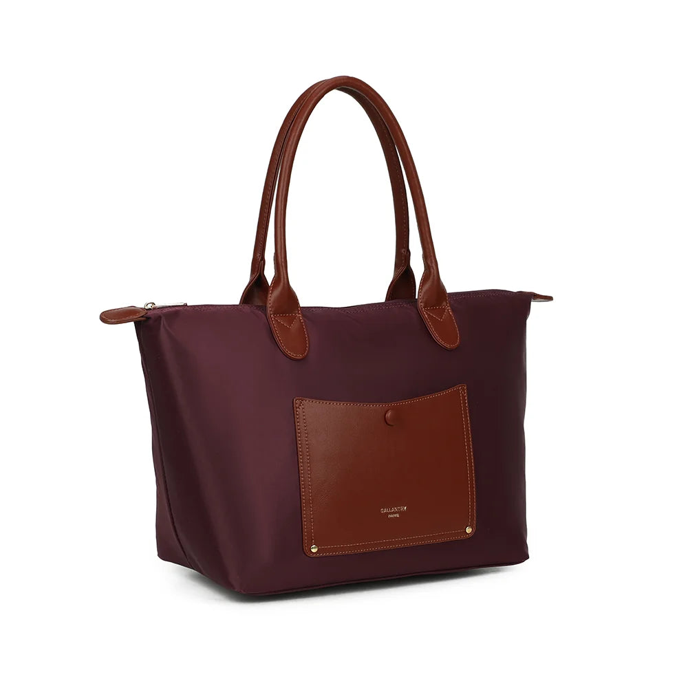 Le Roseau bordeaux de trois quarts : silhouette trapèze et pattes marron aux extrémités du zip – réf. Z-02-1