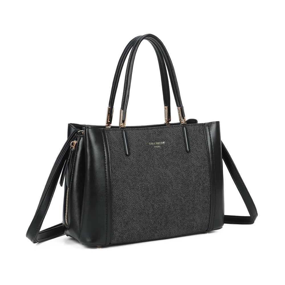 Le Valdora noir de trois quarts : silhouette structurée et zip vertical doré sur le côté – réf. G-7513