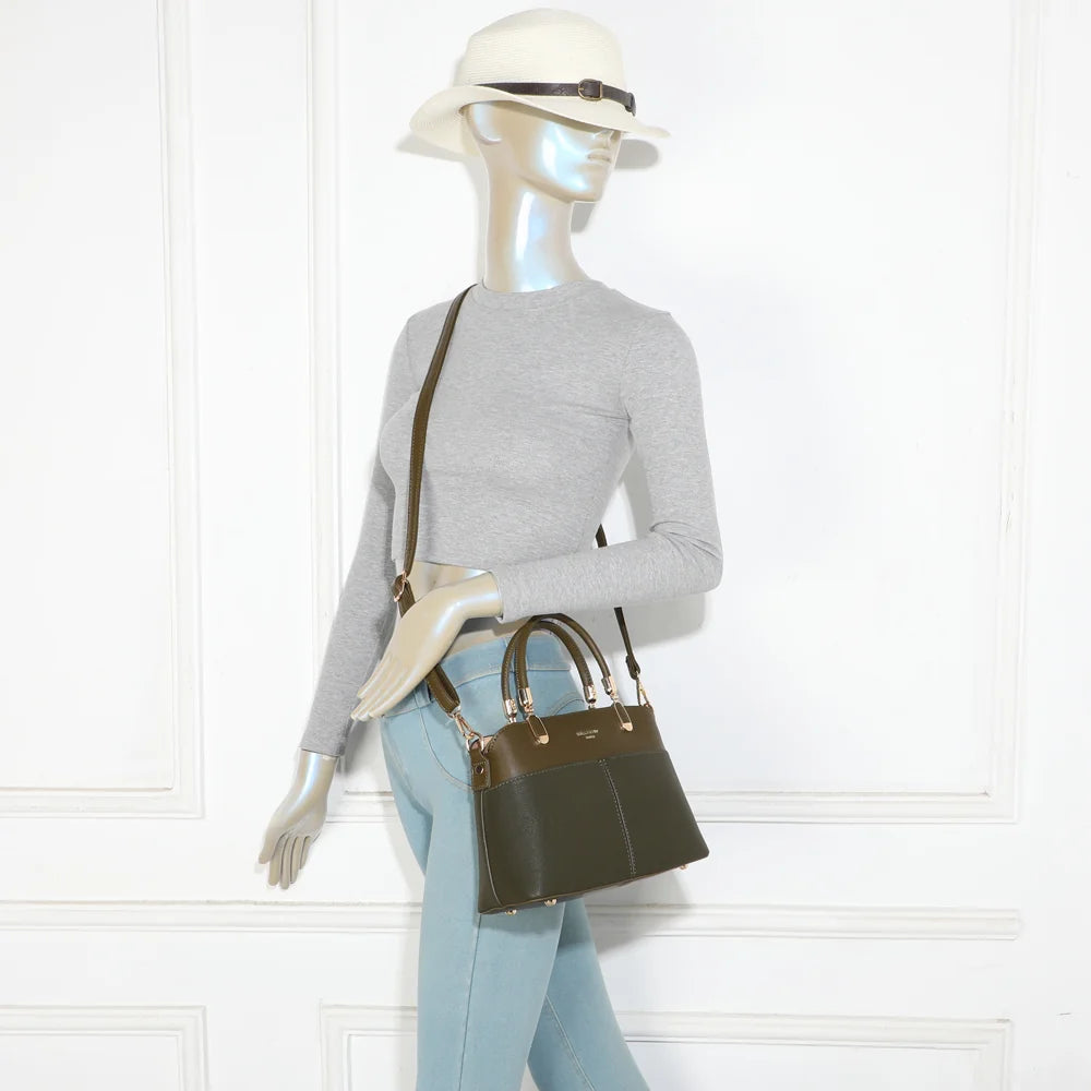 Sac à main femme Le Valmont vert foncé porté à la main, format équilibré et élégant – réf. A-9177