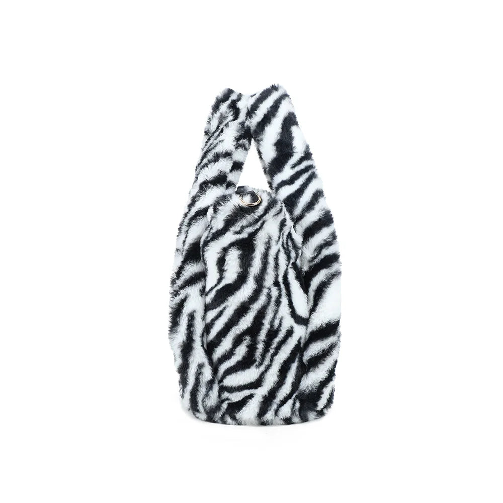 Profil du Léona Douceur zebre : 16 cm de profondeur pour accueillir les essentiels du quotidien