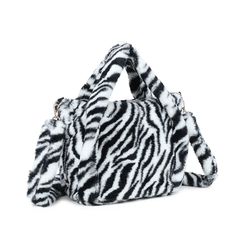 Léona Douceur zebre de trois quarts : volume souple en peluche et mousquetons dorés de la bandoulière