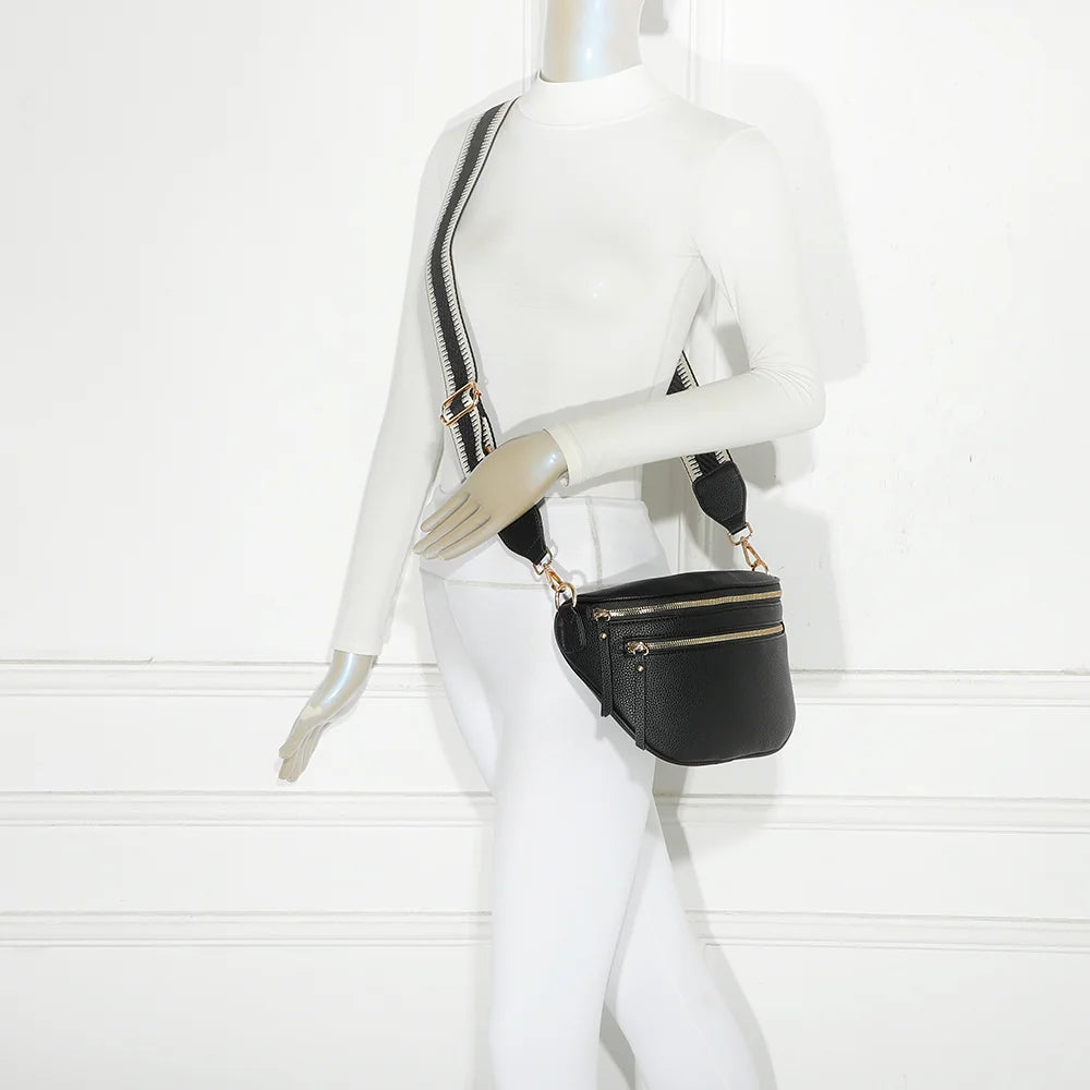 Sac banane femme Léonie noir porté en travers du corps avec sa large bandoulière en tissu – réf. Z-83051-8