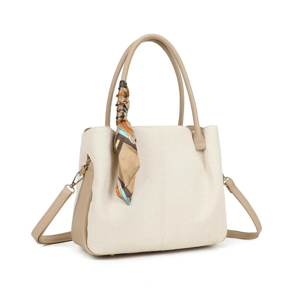 Mademoiselle Canvas beige/taupe vu de trois quarts : forme souple, côtés synthétiques contrastés et attache dorée – réf. A-9157