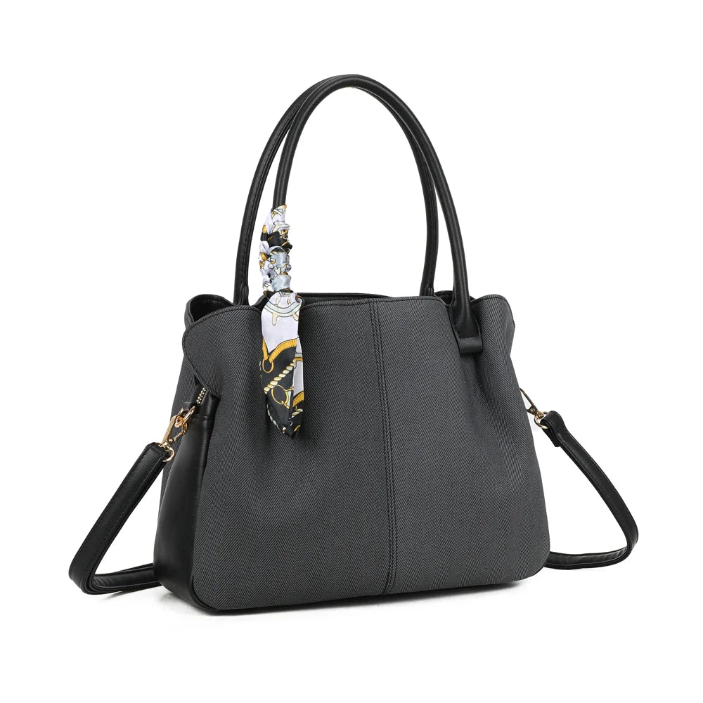Mademoiselle Canvas noir vu de trois quarts : forme souple, côtés synthétiques contrastés et attache dorée – réf. A-9157
