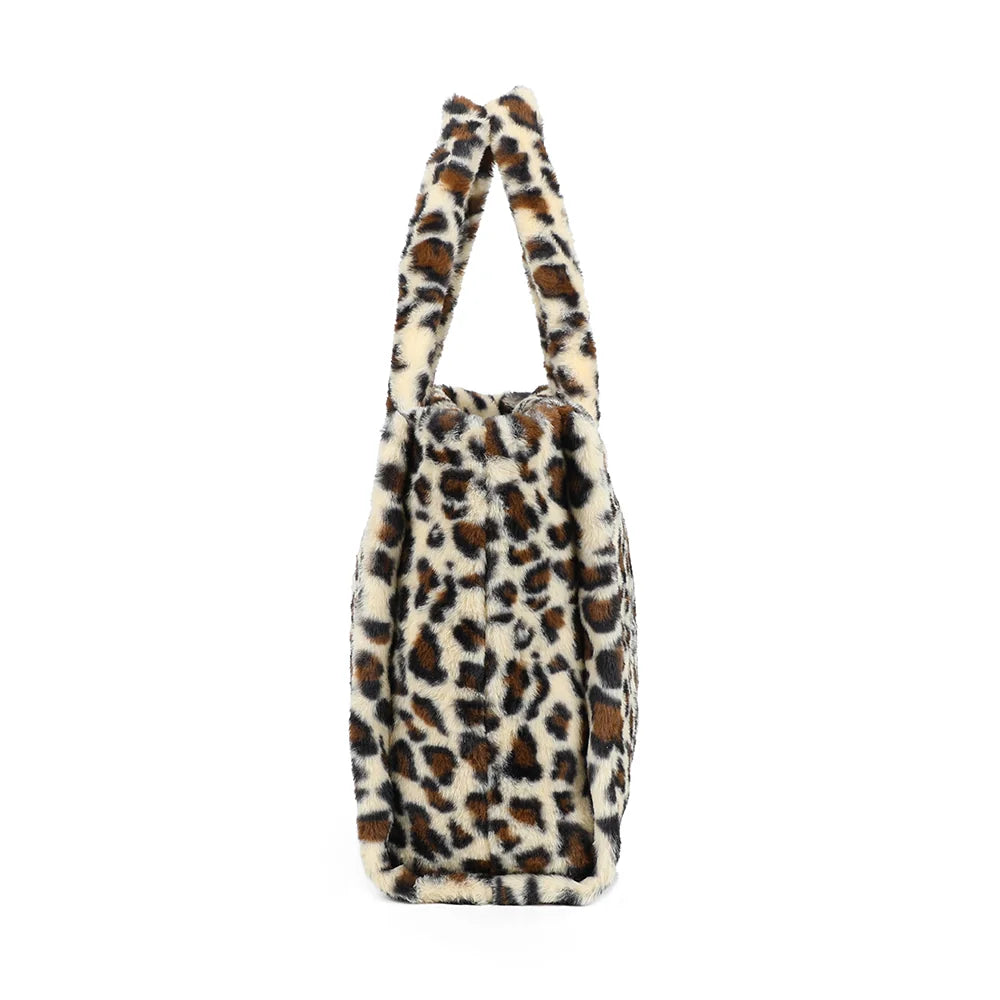 Profil du Mélya l.leopard : soufflet latéral et profondeur de 18 cm pour tout emporter – réf. DG-5802
